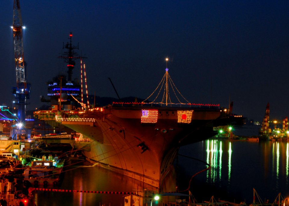 US Navy 071220-N-2638R-001 Holiday lights illuminate USS Kitty Hawk (CV 63) in celebration of the holiday season