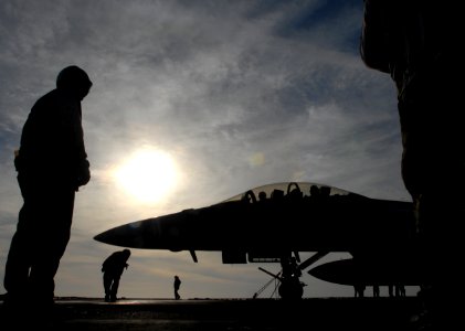 US Navy 071218-N-1688B-347 Crew members assigned to Strike Fighter Squadron (VFA) 32 the stand by on the flight deck aboard USS Harry S. Truman (CVN 75) waiting for their old and new commanding officers as they return from a ch