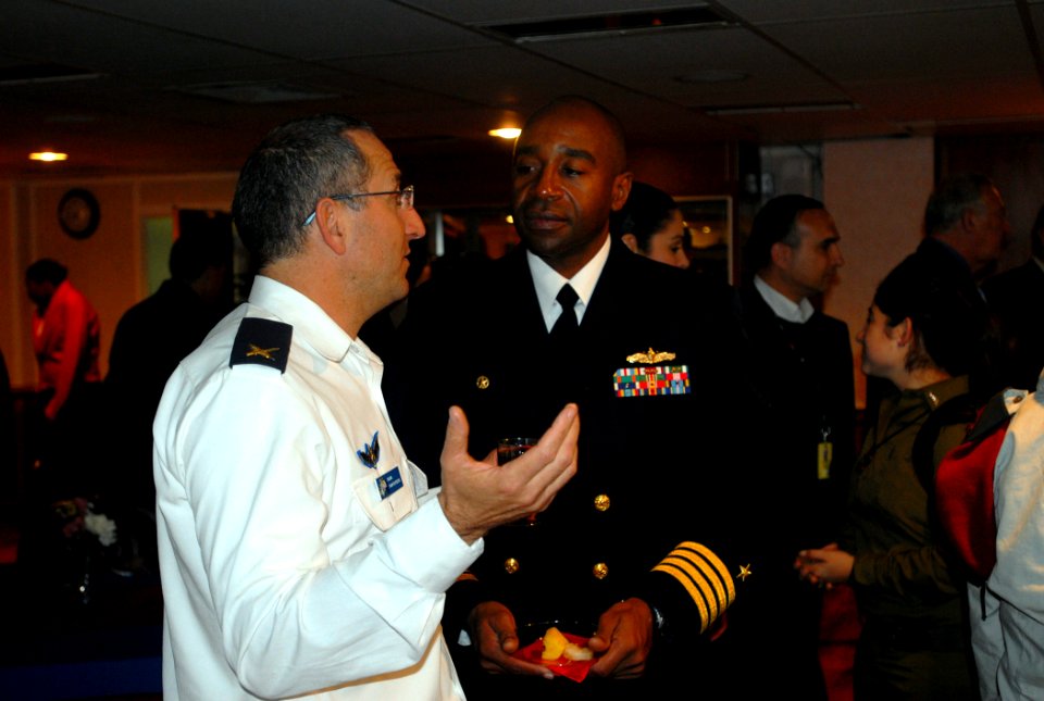 US Navy 080102-N-5307M-053 Commodore Frank Ponds of the Kearsarge Strike Group, converses with Rear Adm. Ram Rutberg, commander, Haifa Naval Base