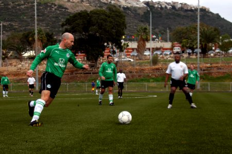 US Navy 080104-N-5642P-175 A member of the Maccabi 35-and-older National Football Team prepares to address the ball during an exhibition game with the Kearsarge Expeditionary Strike Group Team
