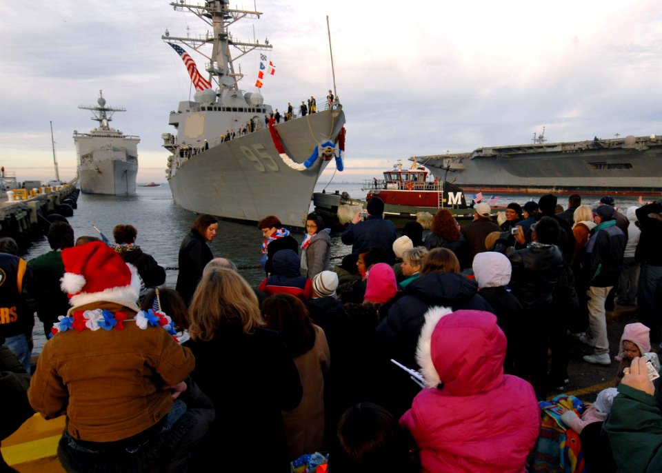 US Navy 071219-N-4515N-046 Friends and family gather pier side on board Naval Station Norfolk to await the arrival of the guided-missile destroyer USS J.E. Williams (DDG 95)