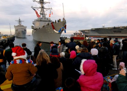 US Navy 071219-N-4515N-046 Friends and family gather pier side on board Naval Station Norfolk to await the arrival of the guided-missile destroyer USS J.E. Williams (DDG 95)