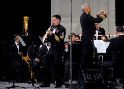 US Navy 071219-N-0773H-165 Senior Chief Musician Timothy E. Roberts performs a solo on a soprano saxophone during the Navy Band performance of Concerto for Soprano Sax and Wind Ensemble at the 61st annual Midwest Clinic
