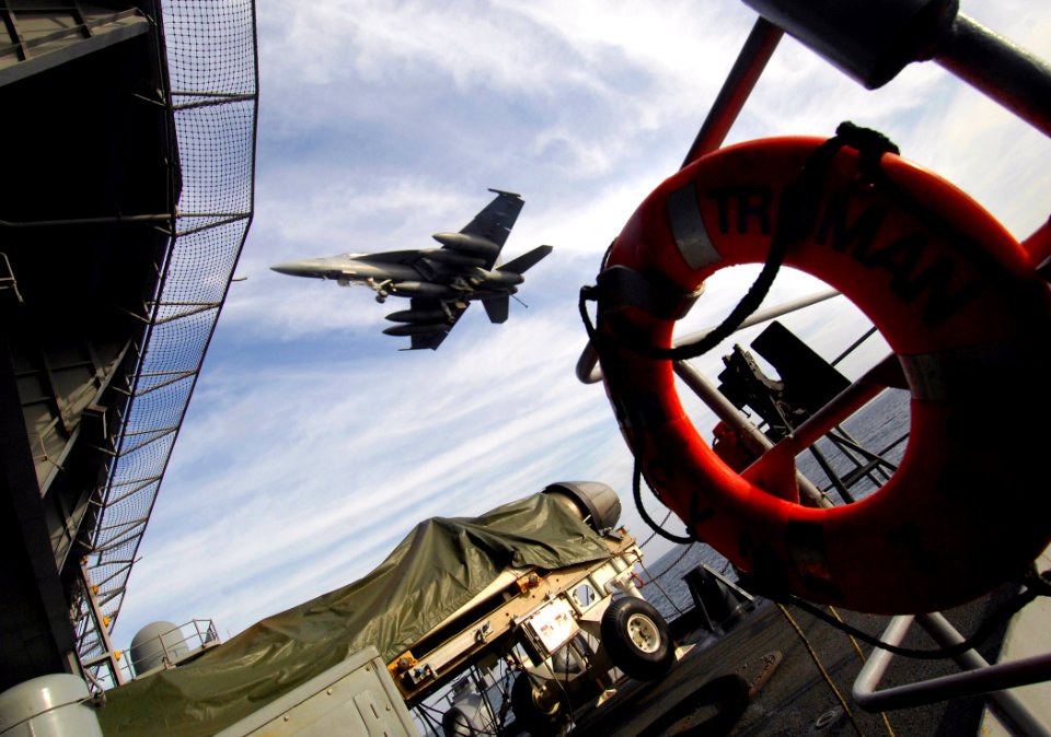 US Navy 071220-N-2984R-221 An F-A-18 Hornet approaches the round-down as it prepares to land on the flight deck of the Nimitz-class nuclear-powered aircraft carrier USS Harry S. Truman (CVN 75)