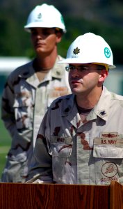 US Navy 071221-N-7367K-011 Lt. Cmdr. Michael Mihaly, officer in charge of Naval Mobile Construction Battalion (NMCB) 1, Guam Det., gives a speech while Senior Chief Builder E. Dan Walker, the detachment's senior enlisted leader