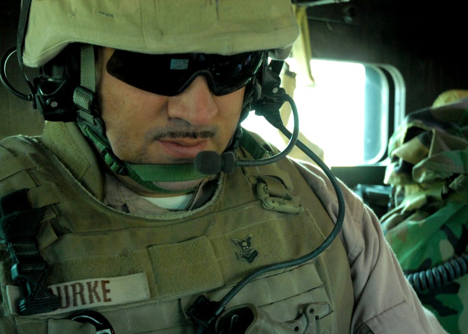 US Navy 080104-N-3857R-003 Storekeeper 1st Class Damien Burke, assigned to a convoy security element (CSE) with Naval Mobile Construction Battalion (NMCB) 1, conducts a radio check before leaving on a convoy