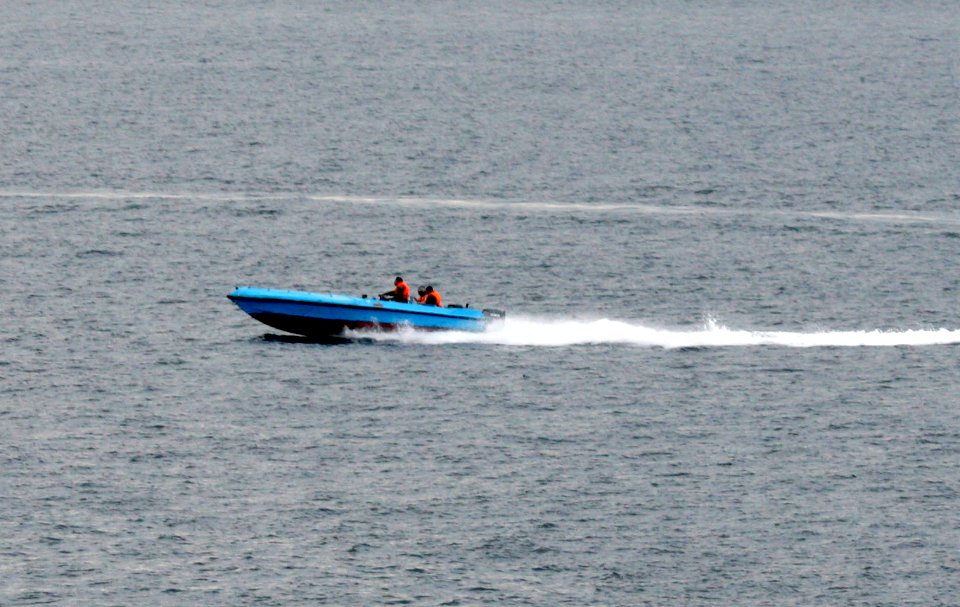 US Navy 080106-N-0000X-003 mall craft suspected to be from the Islamic Republic of Iran Revolutionary Guard Navy (IRGCN), maneuver aggressively in close proximity of U.S. Navy ships
