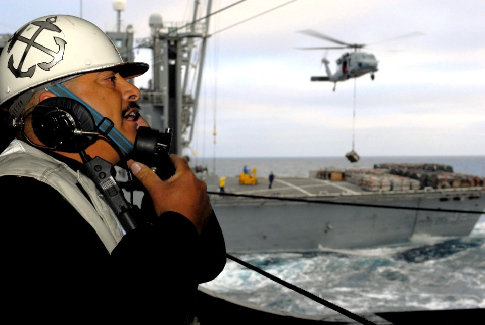 US Navy 080109-N-7526R-024 Chief Boatswain's Mate Dante Zamora relays information from the Military Sealift Command ammunition ship USNS Flint (T-AE 32)