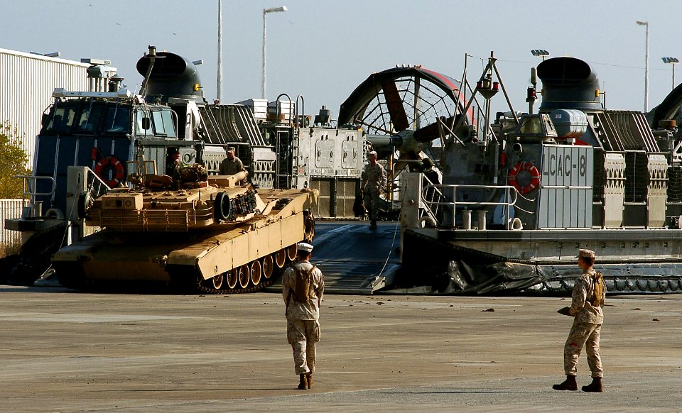 US Navy 080105-N-6597H-529 A landing craft air cushion (LCAC) hovercraft offloads an M-1A1 Abrams tank attached to the 11th Marine Expeditionary Unit