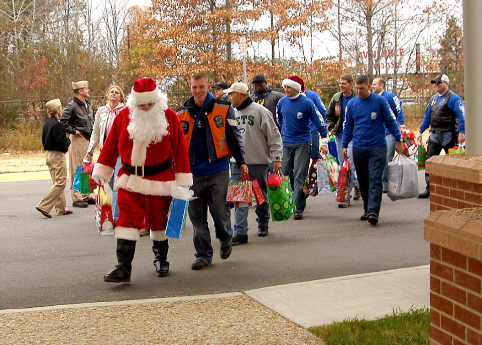 US Navy 071226-N-4669J-017 Santa and members of the motorcycle safety group of Strike Fighter Squadron (VFA) 143, arrive for a visit at the St. Mary's Home for Disabled Children