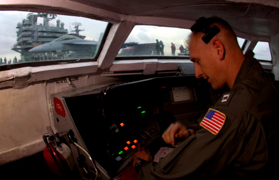 US Navy 080104-N-0455L-003 Lt. Chris Moylan stands watch in the waist bubble to ensure safe launching of aircraft from the flight deck aboard the Nimitz-class nuclear-powered aircraft carrier USS Harry S. Truman (CVN 75)