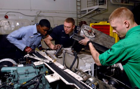 US Navy 080111-N-0455L-004 Aviation Support Equipment Technician Airman Shounie Capers, left, Aviation Support Equipment Technician 3rd Class William Byrum and Aviation Support Equipment Technician 3rd Class James Calderis repl