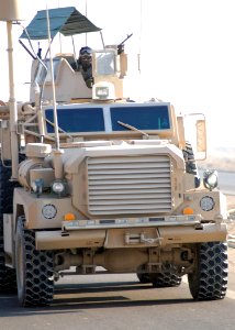US Navy 080104-N-3857R-016 A Seabee assigned to Naval Mobile Construction Battalion (NMCB) 1, mans his M240B machine gun in the vehicle turret as part of a convoy security element (CSE)