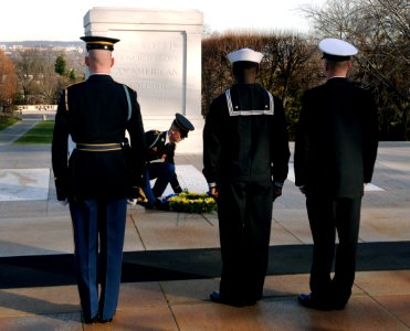 US Navy 080108-N-9769P-002 Chief Machinist's Mate Phillip Wharton and Machinist's Mate 1st Class Jeffrey Harp, along with a Tomb guard lay a wreath at the Tomb of the Unknown Soldier on behalf of Commander, Navy Recruiting Comm