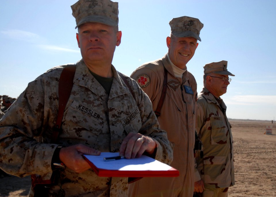 US Navy 080108-N-3857R-007 Marine Brig. Gen. J.A. Kessler, commanding general of 2nd Marine Logistics Group (Forward), holds the signed Beneficial Occupancy Date letter, officially opening the newly renovated runway at Camp Taq
