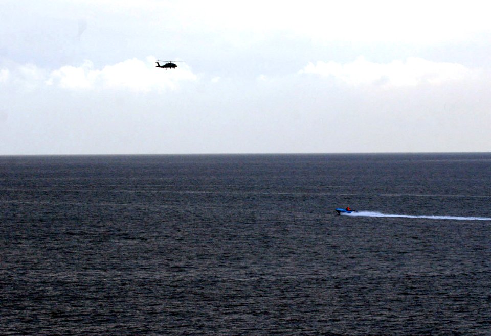 US Navy 080106-N-0000X-006 Small craft suspected to be from the Islamic Republic of Iran Revolutionary Guard Navy (IRGCN), maneuver aggressively in close proximity of U.S. Navy ships