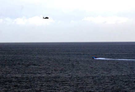 US Navy 080106-N-0000X-006 Small craft suspected to be from the Islamic Republic of Iran Revolutionary Guard Navy (IRGCN), maneuver aggressively in close proximity of U.S. Navy ships