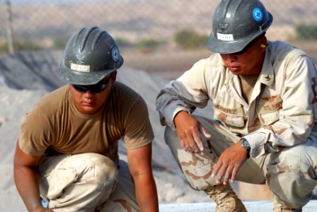 US Navy 080112-N-0260R-006 Builder 2nd Class Johan Sanchez and Steel Worker 3rd Class Andrew Heffron, both assigned to Naval Mobile Construction Battalion (NMCB) 40, work at a building construction site in Obock