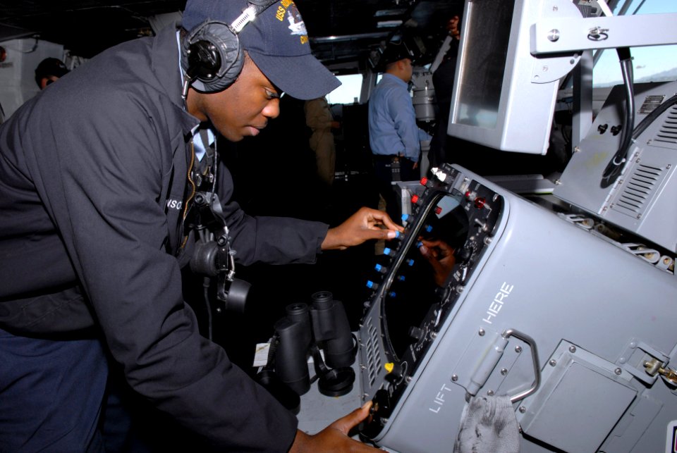 US Navy 080111-N-0640K-002 Operations Specialist 3rd Class Dion Johnson, from Carson, Calif., monitors a radar system on the bridge of the Nimitz-class nuclear-powered aircraft carrier USS Ronald Reagan (CVN 76)