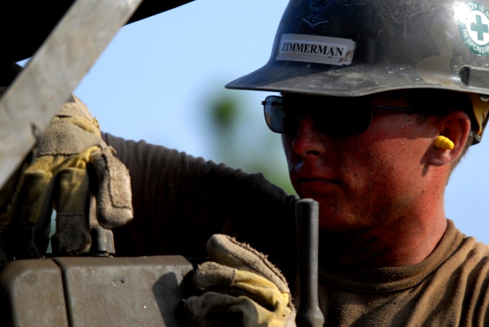 US Navy 080112-N-0260R-013 Construction Electrician 3rd Class Jay Zimmerman, assigned to Naval Mobile Construction Battalion (NMCB) 40, works at a building construction site in Obock