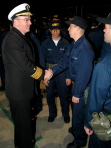 US Navy 080111-N-8848T-001 Vice Adm. John C. Harvey Jr., Chief of Naval Personnel, congratulates recruits for successfully passing Battle Stations and receiving their Navy ballcaps at Recruit Training Command (NTC) at Naval Sta