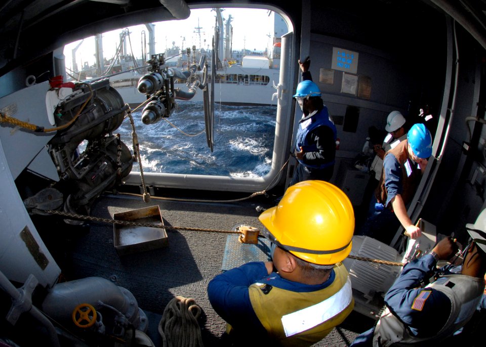 US Navy 080111-N-9150R-041 Boatswain's Mate 2nd Class Junar Balanza watches as the amphibious assault ship USS Boxer (LHD 4) receives a fueling probe from the Military Sealift Command fleet replenishment oiler USNS Guadalupe (T