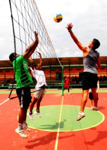 US Navy 080112-N-8933S-127 Seaman Wilfredo Jirauruiz blocks a spike during a volleyball game against the Vieille Gloire (Old Glory) team a local Gabonese volleyball team