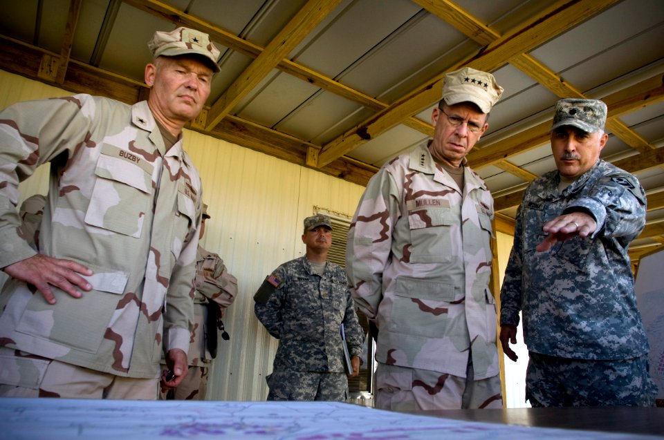 US Navy 080113-N-0696M-036 Col. Manuel Medina, left, deputy engineer, Joint Task Force (JTF) Guantanamo and Rear Adm. Mark Buzby, commander, JTF Guantanamo, brief Adm. Mike Mullen, Chairman of the Joint Chiefs of Staff