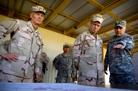 US Navy 080113-N-0696M-036 Col. Manuel Medina, left, deputy engineer, Joint Task Force (JTF) Guantanamo and Rear Adm. Mark Buzby, commander, JTF Guantanamo, brief Adm. Mike Mullen, Chairman of the Joint Chiefs of Staff photo
