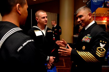 US Navy 080115-N-9818V-283 Master Chief Petty Officer of the Navy (MCPON) Joe R. Campa Jr. talks with two Sailors after he spoke to attendees of the annual Surface Navy Association (SNA) National Symposium held at the Hyatt Reg