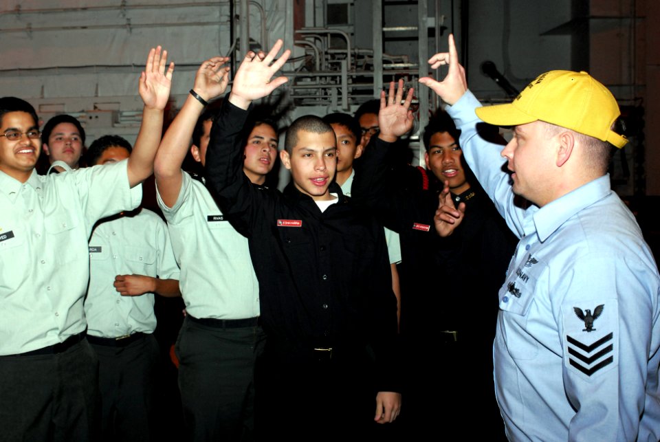 US Navy 080114-N-7526R-049 Aviation Ordnanceman 1st Class Robert Marshall trains Army and Navy Junior Reserve Officer Training Corps (JROTC) members from Santa Barbara, Calif., during a general quarters training evolution in th