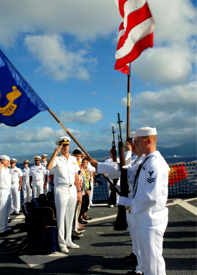 US Navy 080114-N-5476H-040 Rear Adm. Scott Van Buskirk, commander, Carrier Strike Group (CVW) 9, renders a salute for the parading of the colors during a change of command ceremony on the flight deck of the Arleigh Burke-class