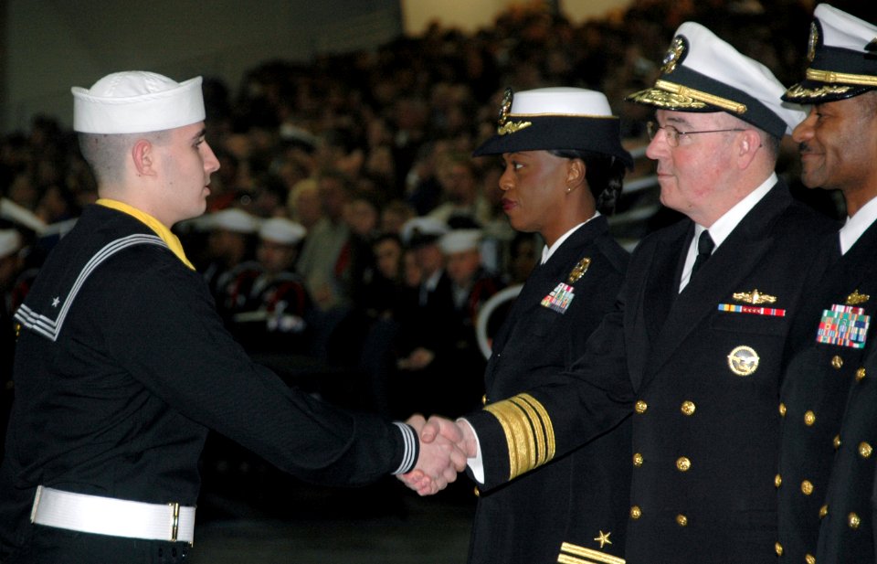 US Navy 080111-N-8848T-003 Vice. Adm. John C. Harvey Jr., Chief of Naval Personnel, shakes hands with Seaman Recruit Brock Michaud, from Newton, N.C., during graduation ceremonies at Recruit Training Command (RTC) at Naval Stat