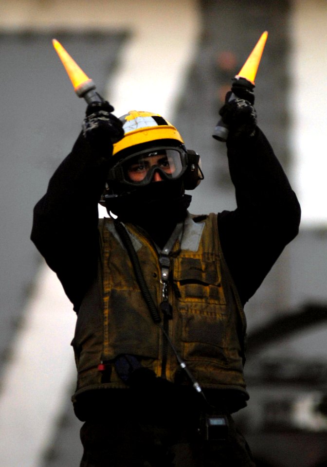 US Navy 080114-N-2984R-121 Aviation Boatswain's Mate (Handler) 3rd Class Gerald J. Garces, assigned to Air Department's V-1 division aboard the Nimitz-class nuclear-powered aircraft carrier USS Harry S. Truman (CVN 75)