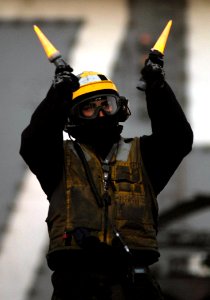 US Navy 080114-N-2984R-121 Aviation Boatswain's Mate (Handler) 3rd Class Gerald J. Garces, assigned to Air Department's V-1 division aboard the Nimitz-class nuclear-powered aircraft carrier USS Harry S. Truman (CVN 75)