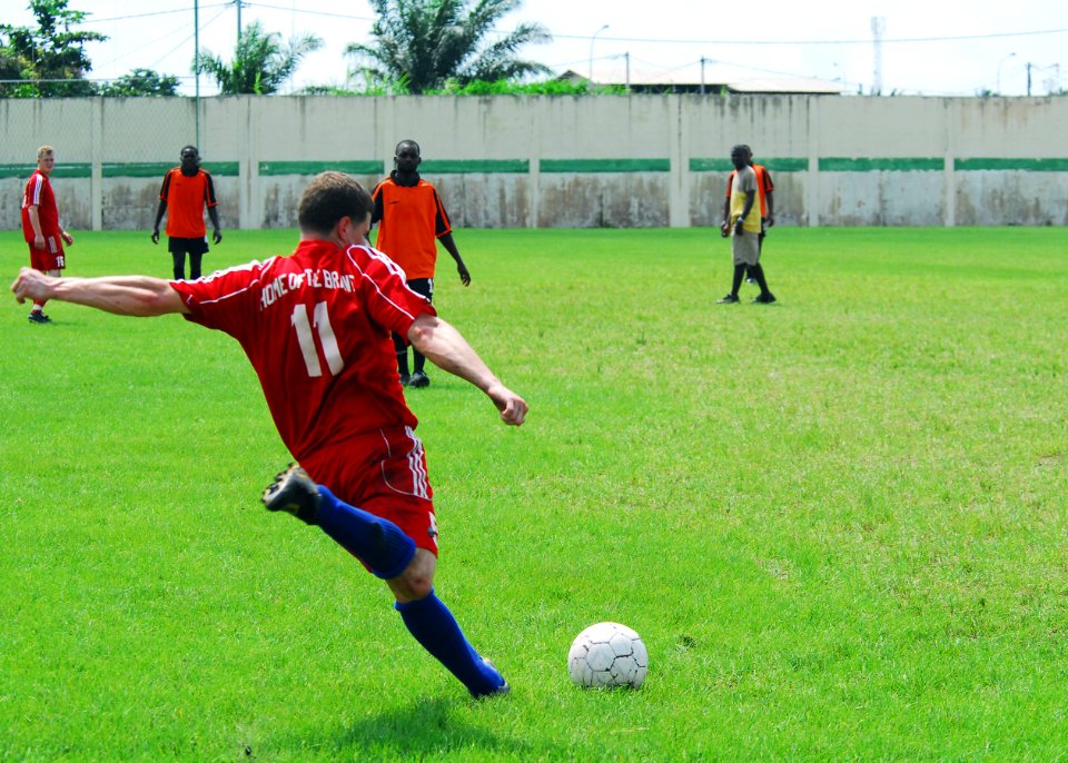 US Navy 080113-N-8933S-043 Information Systems Technician 2nd Class Mark Heier, assigned to the amphibious dock landing ship USS Fort McHenry (LSD 43) as part of Africa Partnership Station (APS), plays soccer with local Gabones