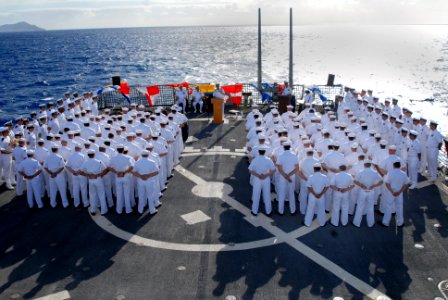US Navy 080114-N-5476H-046 Sailors stand in ranks during a change of command ceremony on the flight deck of the Arleigh Burke-class guided-missile destroyer USS Russell (DDG 59)