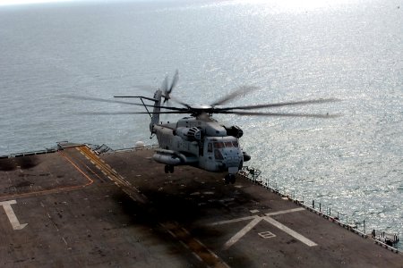 US Navy 080118-N-8335D-051 A CH-53E Super Stallion from Marine Medium Helicopter Squadron 166 Reinforced (HMM-166, REIN) takes off from the flight deck of the amphibious assault ship USS Tarawa (LHA 1) photo