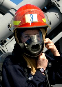 US Navy 080123-N-4649C-029 Damage Controlman Fireman Jessica Lambert prepares for a rescue and assistance drill aboard the guided-missile cruiser USS Shiloh (CG 67)