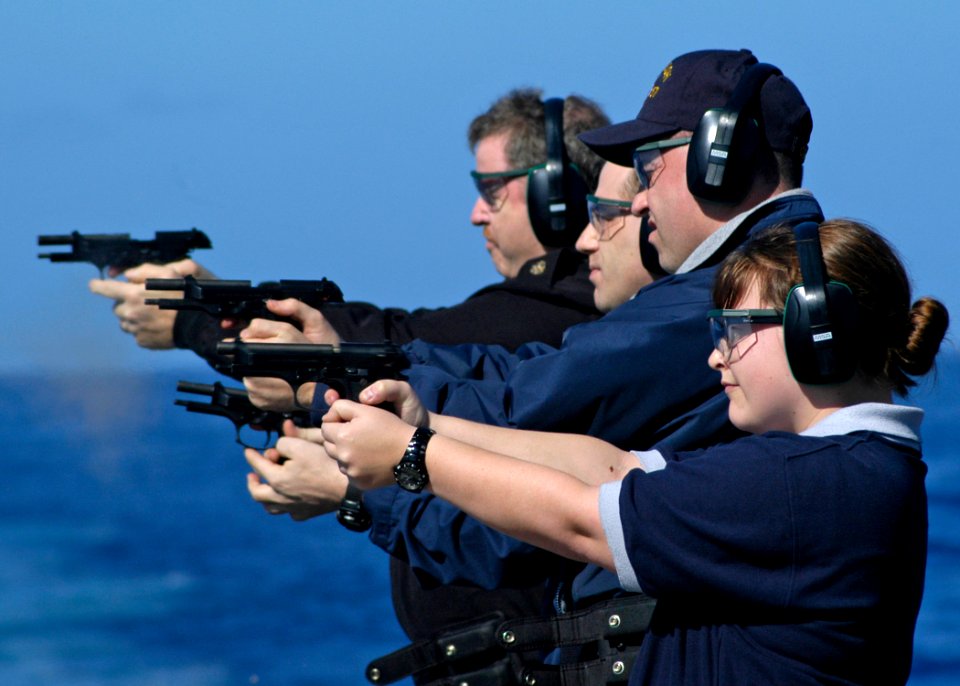 US Navy 080121-N-4649C-016 Sailors aboard the guided-missile cruiser USS Shiloh (CG 67) fire 9 mm handguns during small arms qualifications