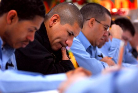 US Navy 080117-N-7526R-087 Aviation Boatswain's Mate (handling) 1st Class Ruben Martinez concentrates on a question during the chief petty officer exam aboard the Nimitz-class nuclear-powered aircraft carrier USS Ronald Reagan