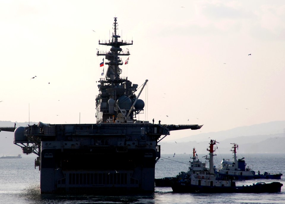 US Navy 080124-N-6710M-002 The amphibious assault ship USS Essex (LHD 2) navigates Sasebo Harbor as she gets underway for a scheduled two-month deployment