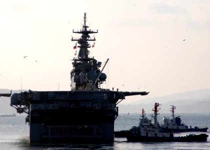 US Navy 080124-N-6710M-002 The amphibious assault ship USS Essex (LHD 2) navigates Sasebo Harbor as she gets underway for a scheduled two-month deployment