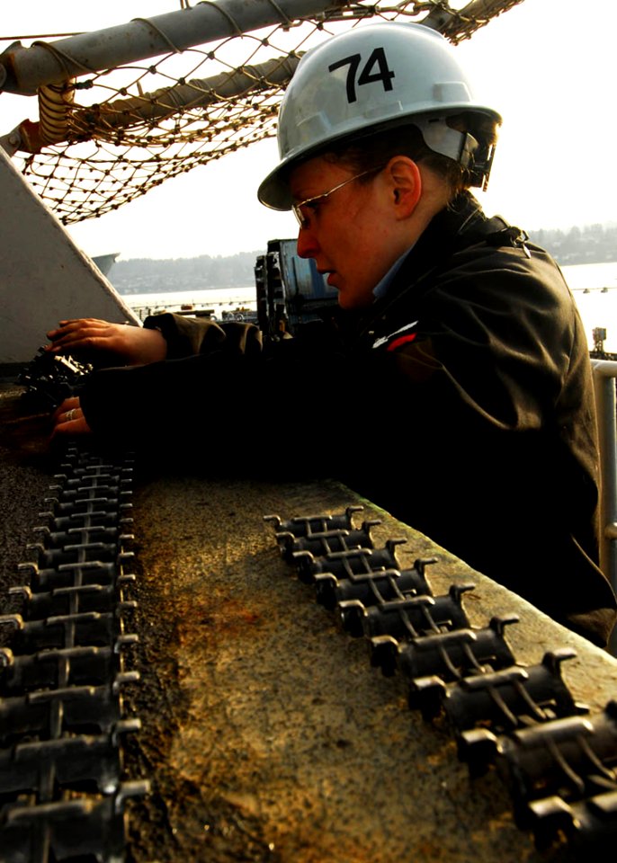 US Navy 080116-N-6538W-005 Fire Controlman 3rd Class Geneva Myers performs maintenance on the PHALANX close-in weapons system (CIWS) on the fantail aboard USS John C. Stennis (CVN 74)