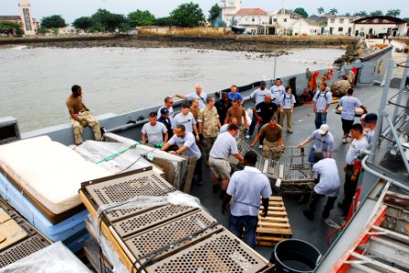 US Navy 080122-N-8933S-238 Africa Partnership Station (APS) Sailors move hospital beds from a landing craft utility to a local hospital designated from Project Handclasp