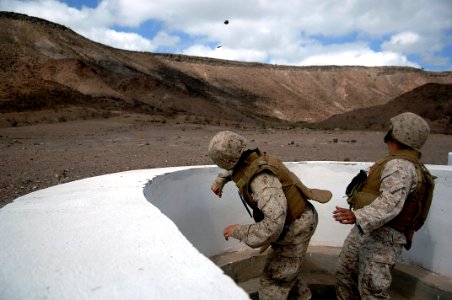 US Navy 080123-F-1644L-044 A Marine assigned to the 3rd Low Altitude Air Defense Battalion, throws a M-67 Fragment Grenade at the firing range