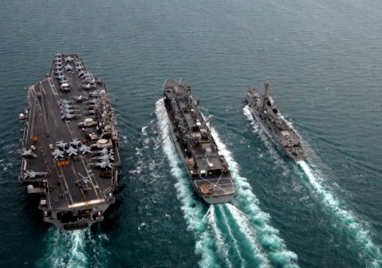 US Navy 080123-N-0535P-578 The aircraft carrier USS Harry S. Truman (CVN 75), left, performs a replenishment at sea with the fast combat support ship USNS Arctic (T-AOE 8) and the Arleigh Burke-class guided-missile destroyer US