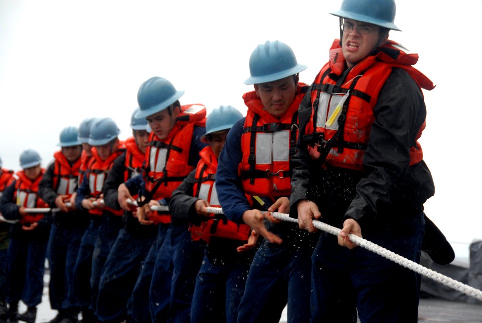 US Navy 080126-N-8546L-048 Sailors aboard the amphibious command ship USS Blue Ridge (LCC 19) pull a line during an underway replenishment