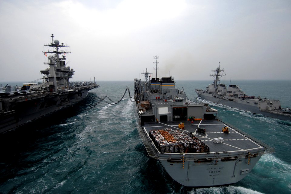 US Navy 080123-N-0535P-296 The aircraft carrier USS Harry S. Truman (CVN 75), left, performs a replenishment at sea with the fast combat support ship USNS Arctic (T-AOE 8) and the Arleigh Burke-class guided-missile destroyer US