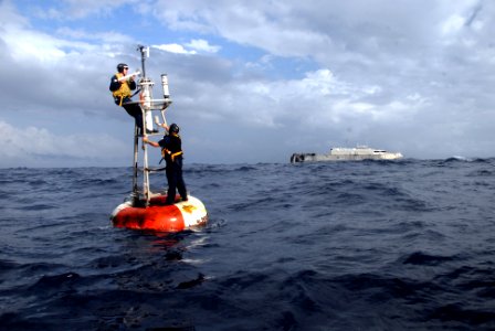US Navy 080125-N-0193M-448 Mineman 2nd Class Matthew Rishovd, top, works with Mineman 2nd Class Kody Egelhoff, both assigned to high speed vessel (HSV) 2 Swift, to repair a Pirata bouy for the National Oceanic and Atmospheric A